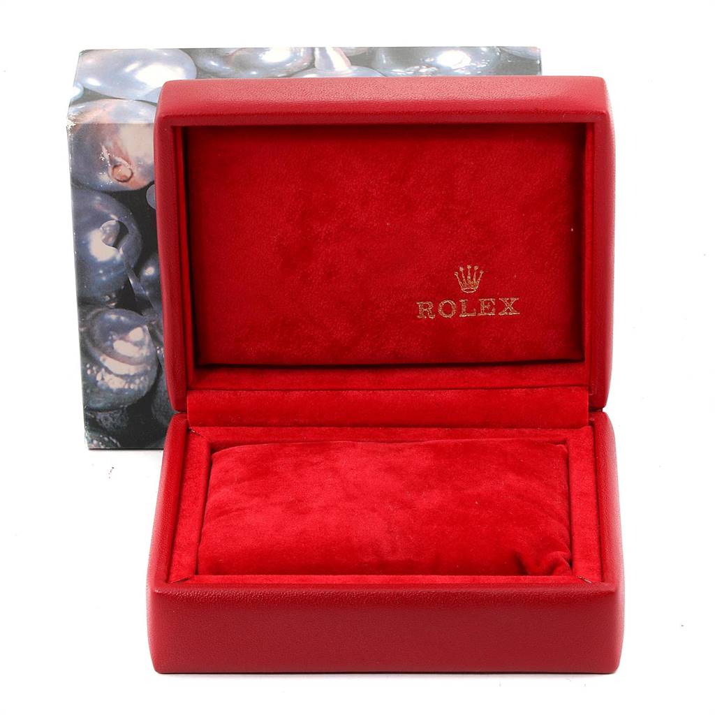 The image shows an open red Rolex Datejust 69163 Women
s Stainless Steel Blue Dial 69163 Women
s Stainless Steel Blue Dial watch box with a velvet interior and the Rolex logo inside.