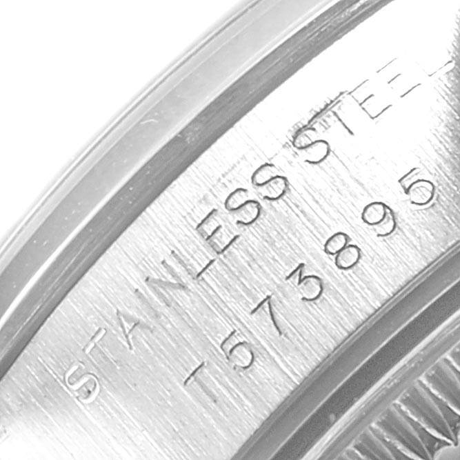 The image shows a close-up of the stainless steel back cover of a Rolex Datejust 69163 Women
s Stainless Steel Blue Dial 69163 Women
s Stainless Steel Blue Dial watch with visible serial numbers.