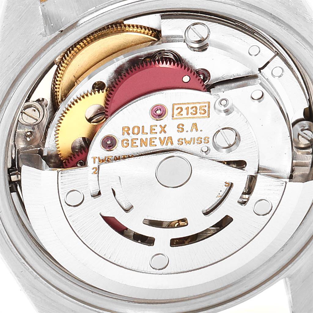 The image shows the internal movement (caliber 2135) of a Rolex Datejust 69163 Women
s Stainless Steel Blue Dial 69163 Women
s Stainless Steel Blue Dial watch.