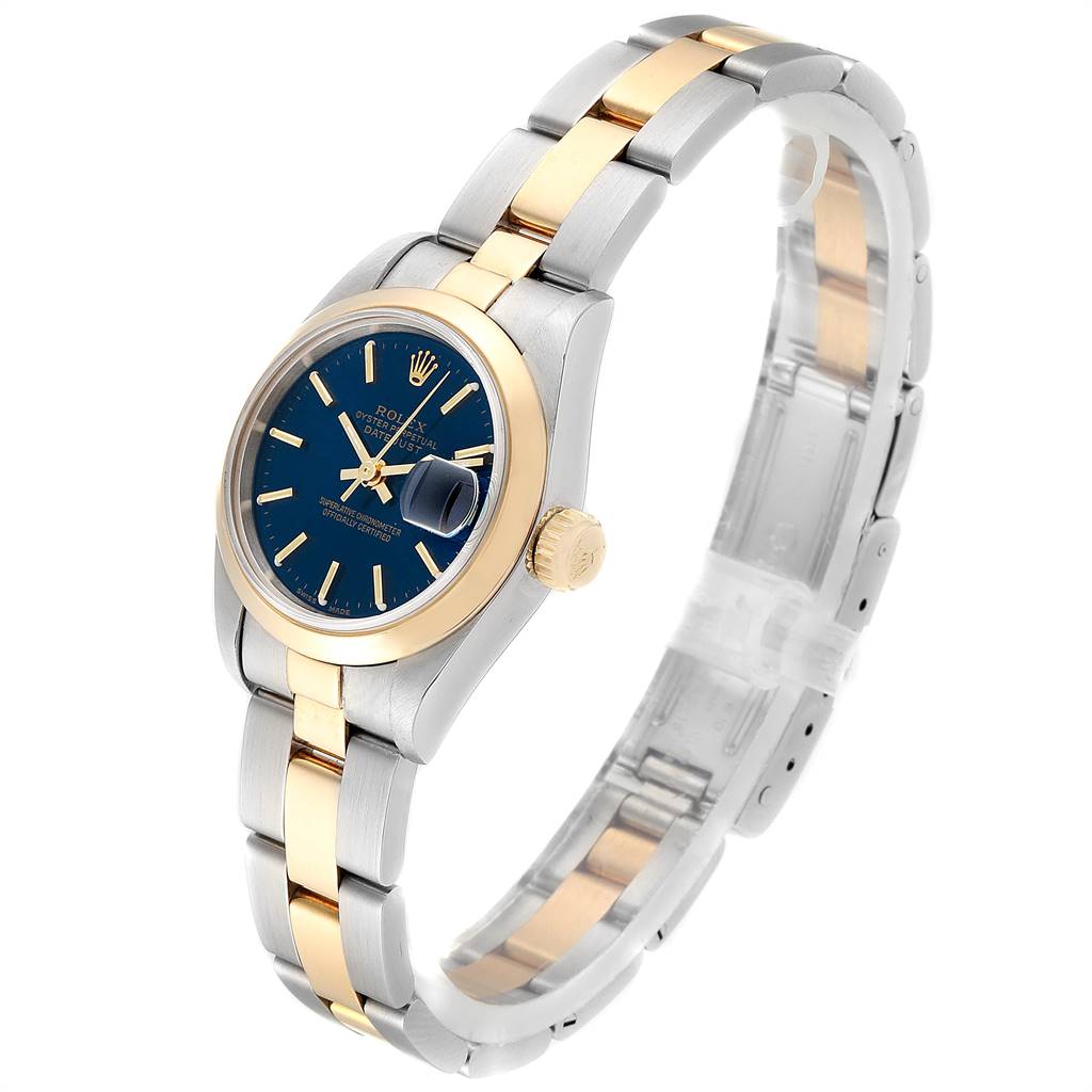 This image shows a Rolex Datejust 69163 Women
s Stainless Steel Blue Dial 69163 Women
s Stainless Steel Blue Dial watch at a three-quarter angle, highlighting its blue dial, two-tone bracelet, and gold bezel.