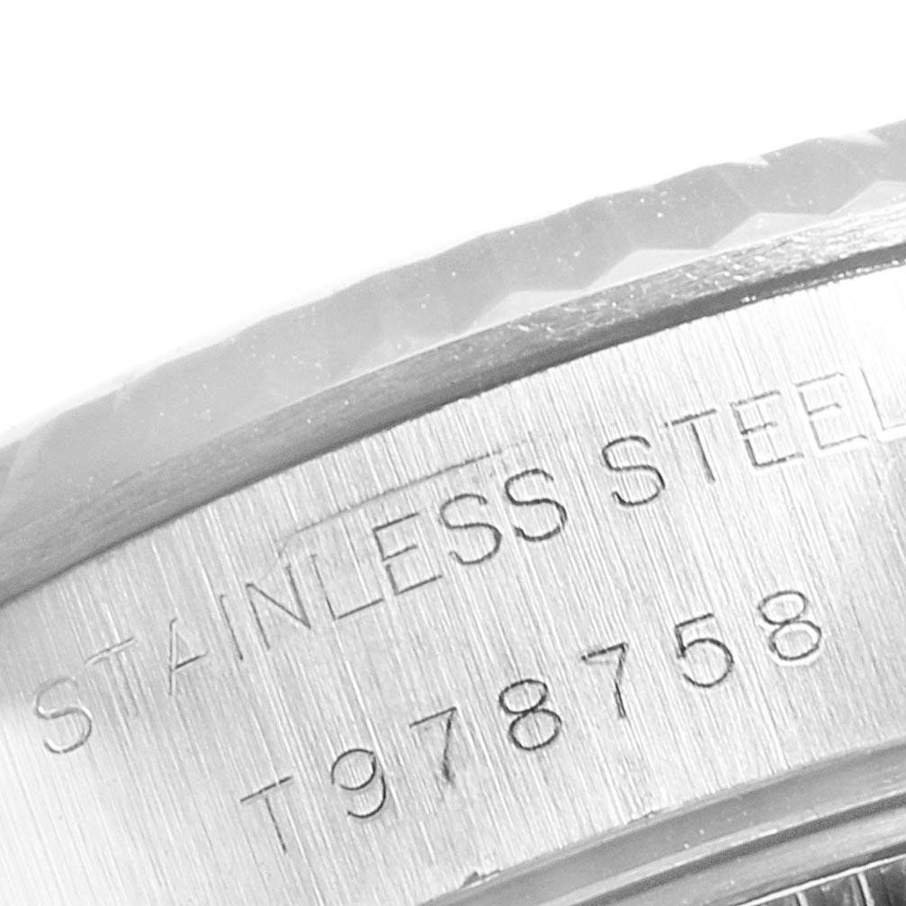 The image shows a close-up of the casing edge and serial number of a Rolex Datejust 69174 Women's Stainless Steel Silver Dial 69174 Women's Stainless Steel Silver Dial watch.