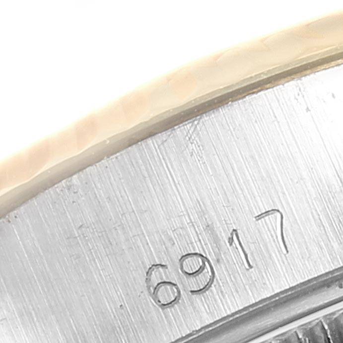 This image shows a close-up of the serial number "6917" on the case of a Rolex Datejust 6917 Women's Steel and Gold (two tone) Champagne Dial 6917 Women's Steel and Gold (two tone) Champagne Dial watch.