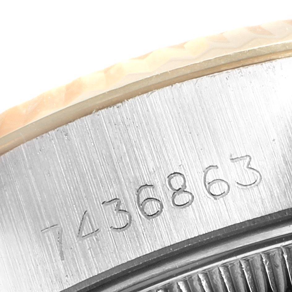 This close-up shows the serial number engraving on the side of a Rolex Datejust 6917 Women's Steel and Gold (two tone) Champagne Dial 6917 Women's Steel and Gold (two tone) Champagne Dial model watch case.