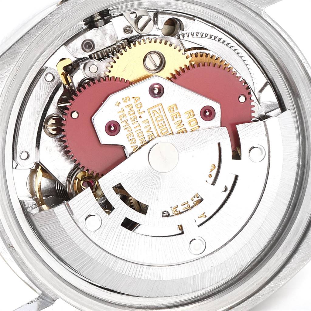 This image shows the internal mechanical movement of a Rolex Datejust 6917 Women's Steel and Gold (two tone) Champagne Dial 6917 Women's Steel and Gold (two tone) Champagne Dial watch, highlighting gears and components from an overhead angle.