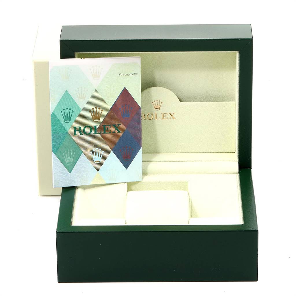 This image shows an open Rolex Datejust 179173 Women's Steel and Gold (two tone) Silver Dial 179173 Women's Steel and Gold (two tone) Silver Dial watch box with a booklet inside, viewed from the front.