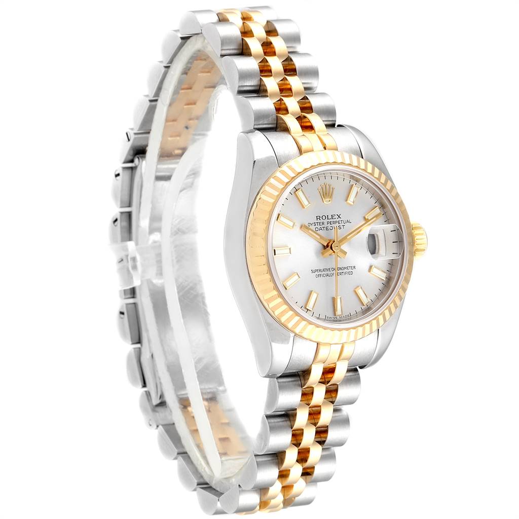 The image shows a Rolex Datejust 179173 Women's Steel and Gold (two tone) Silver Dial 179173 Women's Steel and Gold (two tone) Silver Dial watch at a three-quarter angle, featuring its two-tone bracelet, fluted bezel, and white dial.