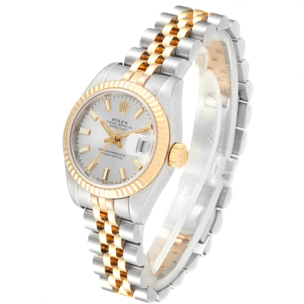 This image shows a Rolex Datejust 179173 Women's Steel and Gold (two tone) Silver Dial 179173 Women's Steel and Gold (two tone) Silver Dial watch, featuring a fluted bezel, a two-tone bracelet, and a silver dial with gold hour markers.