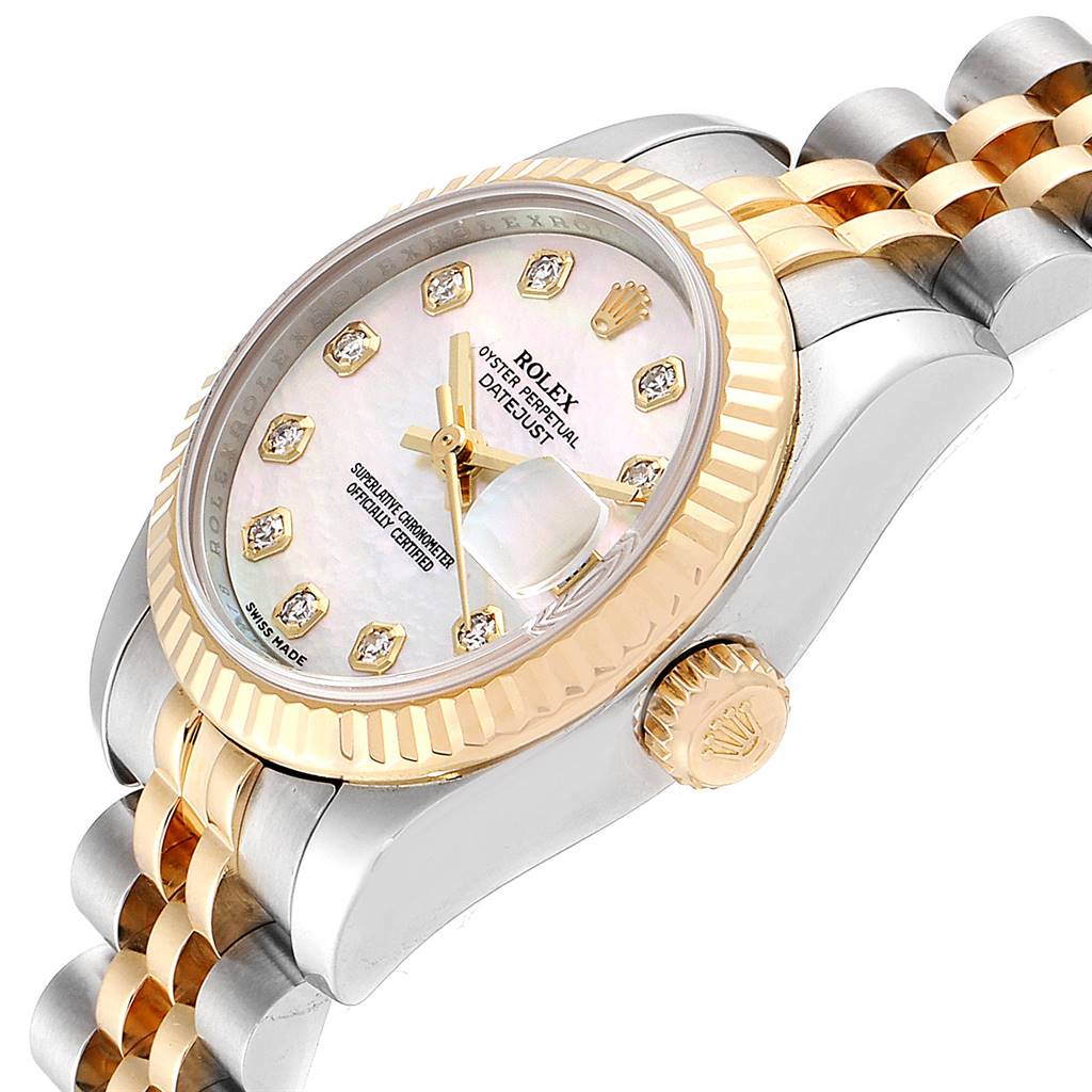This Rolex Datejust 179173 Women's Steel and Gold (two tone) Mother of Pearl Dial 179173 Women's Steel and Gold (two tone) Mother of Pearl Dial watch is shown from an angled side view, highlighting its crown, dial, bezel, and part of the bracelet.