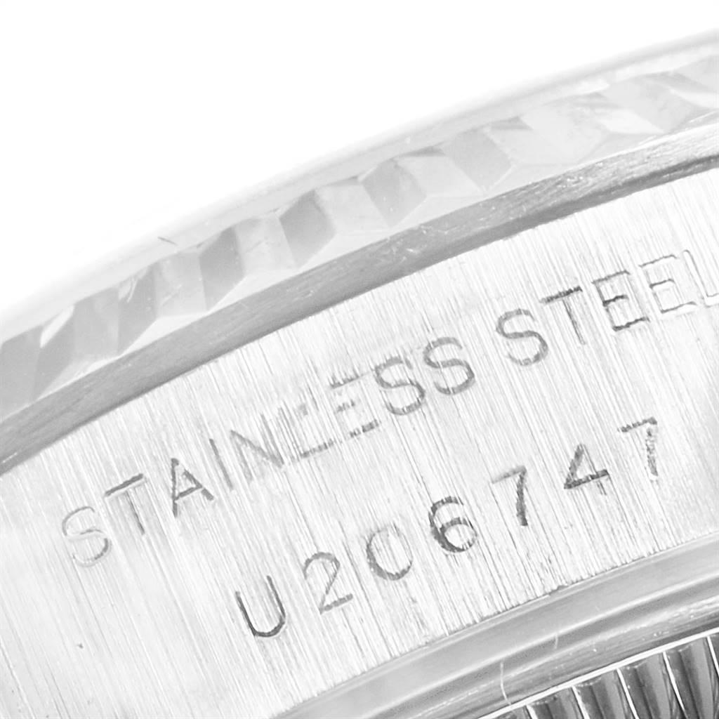 The image shows a close-up of the bezel and case with serial number engraving of a Rolex Datejust 69174 Women's Stainless Steel Pink Dial 69174 Women's Stainless Steel Pink Dial watch.