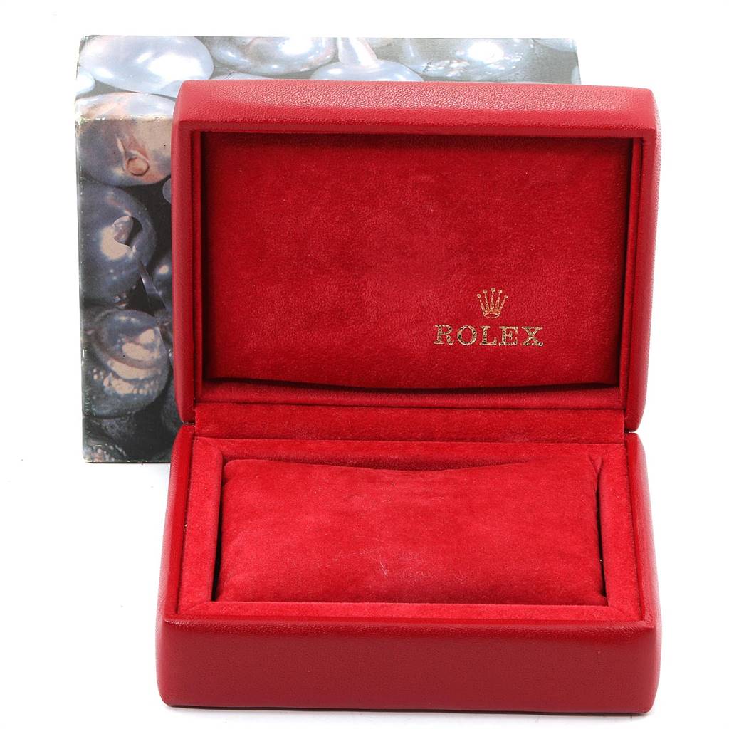 The image shows an open red Rolex watch box for a Datejust model, featuring the brand's logo.