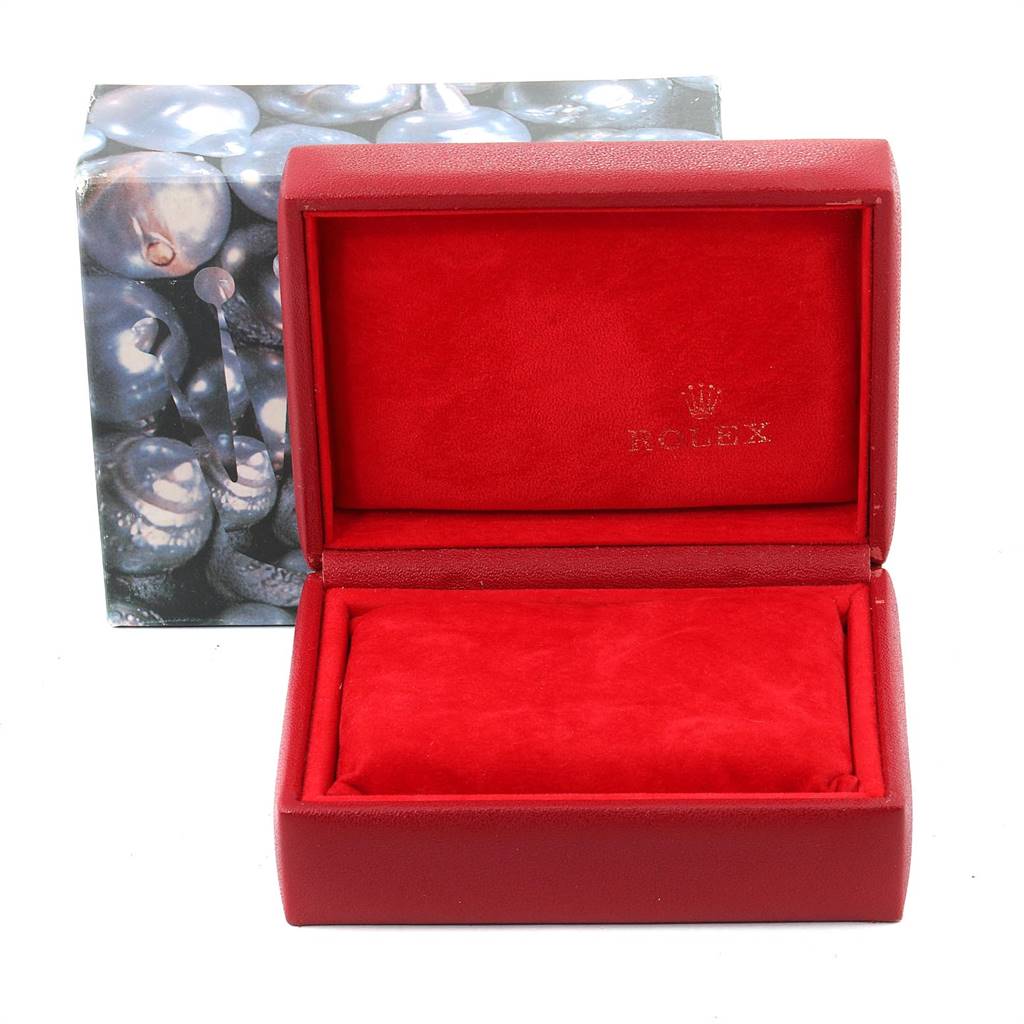 The image shows a red Rolex Datejust 69174 Women's Stainless Steel Blue Dial 69174 Women's Stainless Steel Blue Dial watch box with the lid open, revealing the cushioned interior and the Rolex logo.