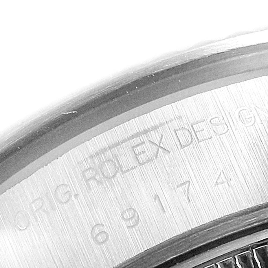 This image shows a close-up of the case back of a Rolex Datejust 69174 Women's Stainless Steel Grey Dial 69174 Women's Stainless Steel Grey Dial watch, highlighting the engraved text.