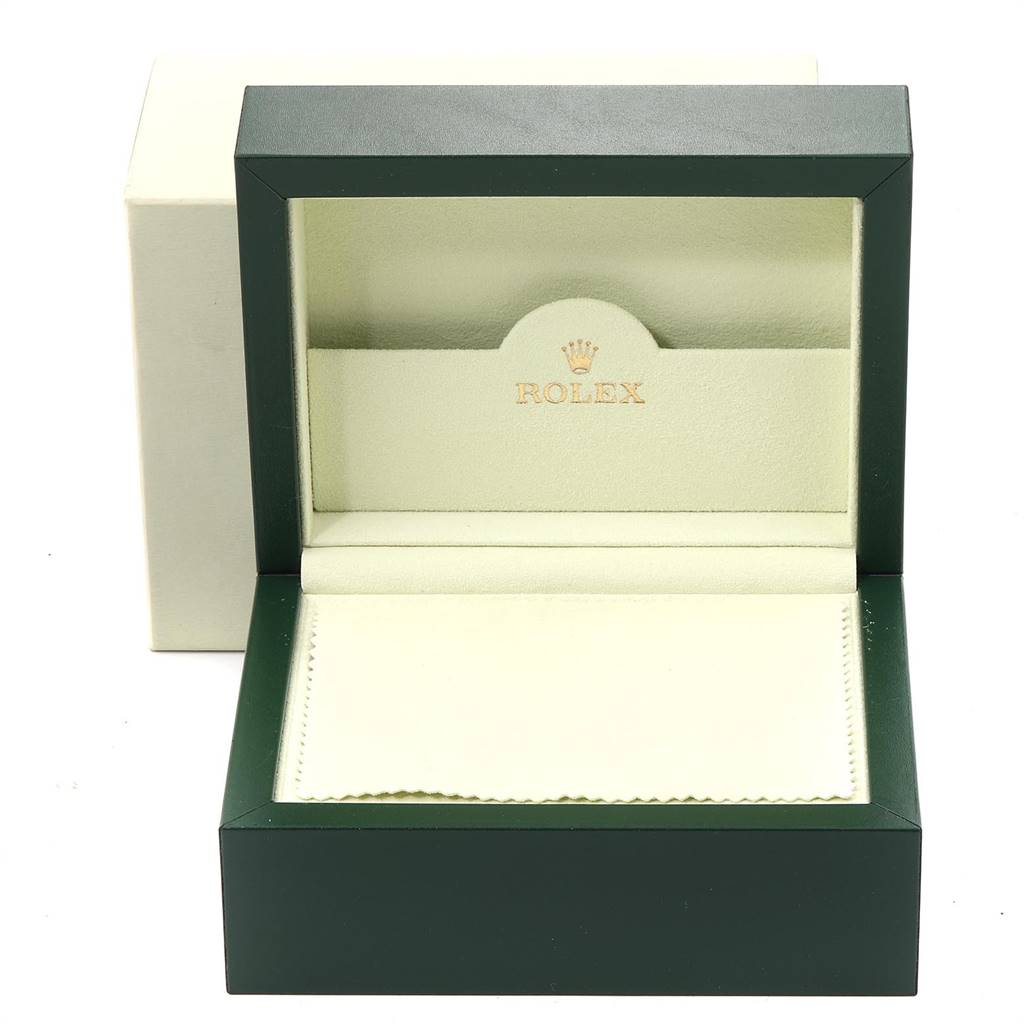 This image shows an open Rolex Datejust 179174 Women
s Stainless Steel Grey Dial 179174 Women
s Stainless Steel Grey Dial watch box with a green exterior and beige interior.