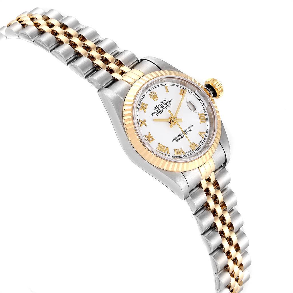 The image shows a side angle of a Rolex Datejust 79173 Women's Steel and Gold (two tone) White Dial 79173 Women's Steel and Gold (two tone) White Dial watch, highlighting its two-tone bracelet, fluted bezel, and white dial with Roman numerals.