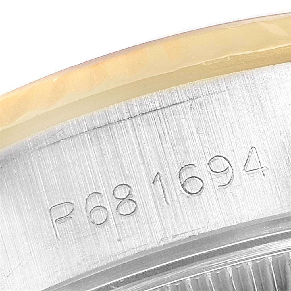 The image shows a close-up view of the serial number engraved on the case side of a Rolex Datejust 69173 Women's Stainless Steel Champagne Dial 69173 Women's Stainless Steel Champagne Dial watch.