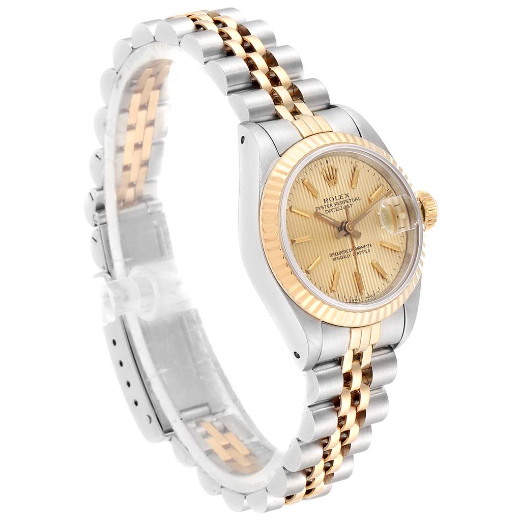 The image shows a Rolex Datejust 69173 Women's Stainless Steel Champagne Dial 69173 Women's Stainless Steel Champagne Dial watch at a three-quarter angle, highlighting its gold bezel, champagne dial, and Jubilee bracelet.