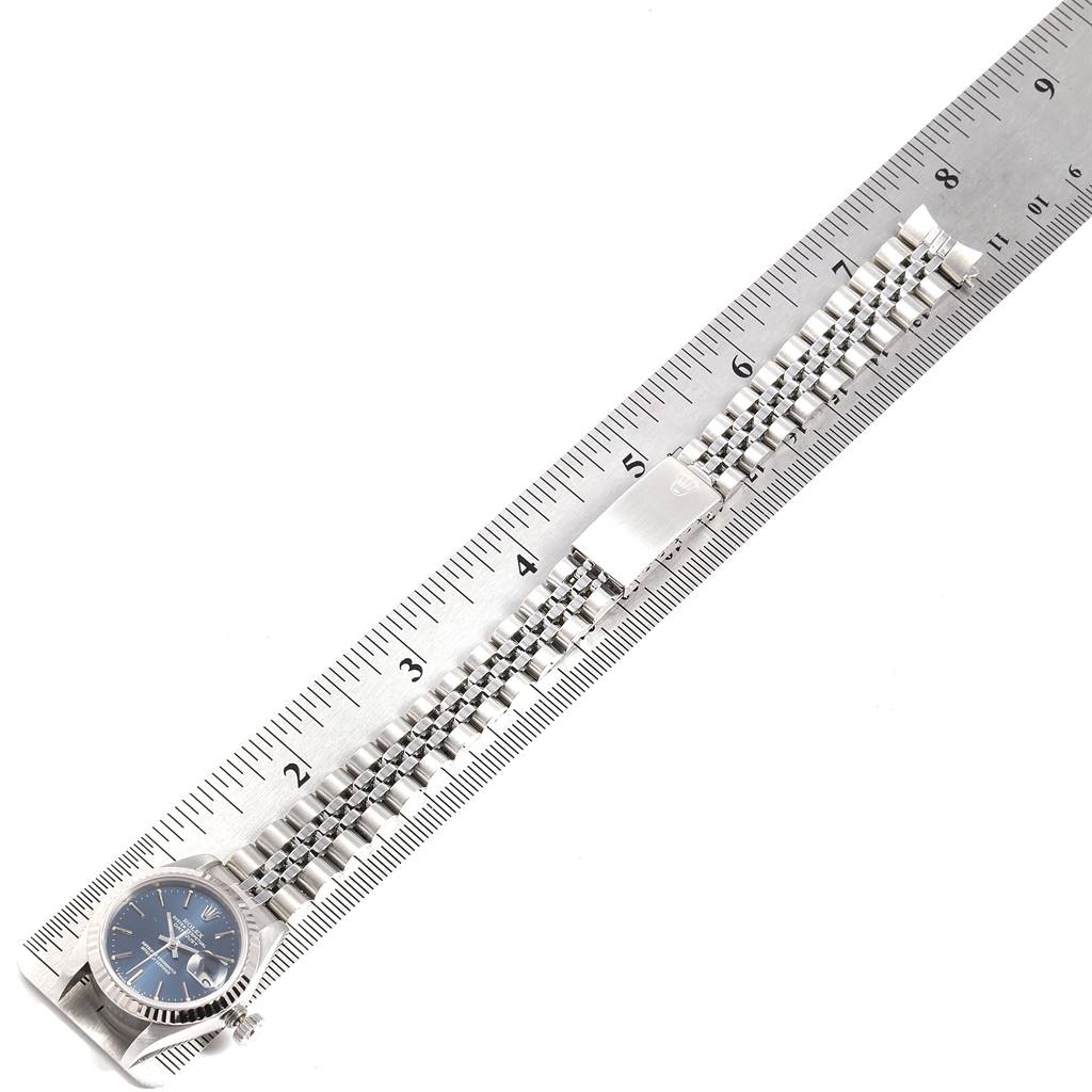 The image shows a Rolex Datejust 69174 Women's Stainless Steel Blue Dial 69174 Women's Stainless Steel Blue Dial watch and bracelet laid flat against a ruler for measurement.