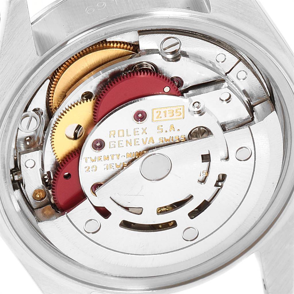 This image shows the movement mechanism of the Rolex Datejust 69174 Women's Stainless Steel Blue Dial 69174 Women's Stainless Steel Blue Dial, featuring gears and internal components from a close-up angle.