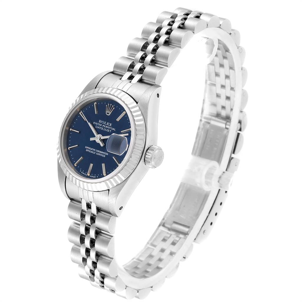 This is a side angle view of a Rolex Datejust 69174 Women's Stainless Steel Blue Dial 69174 Women's Stainless Steel Blue Dial, showing the face, dial, bezel, and Jubilee bracelet.