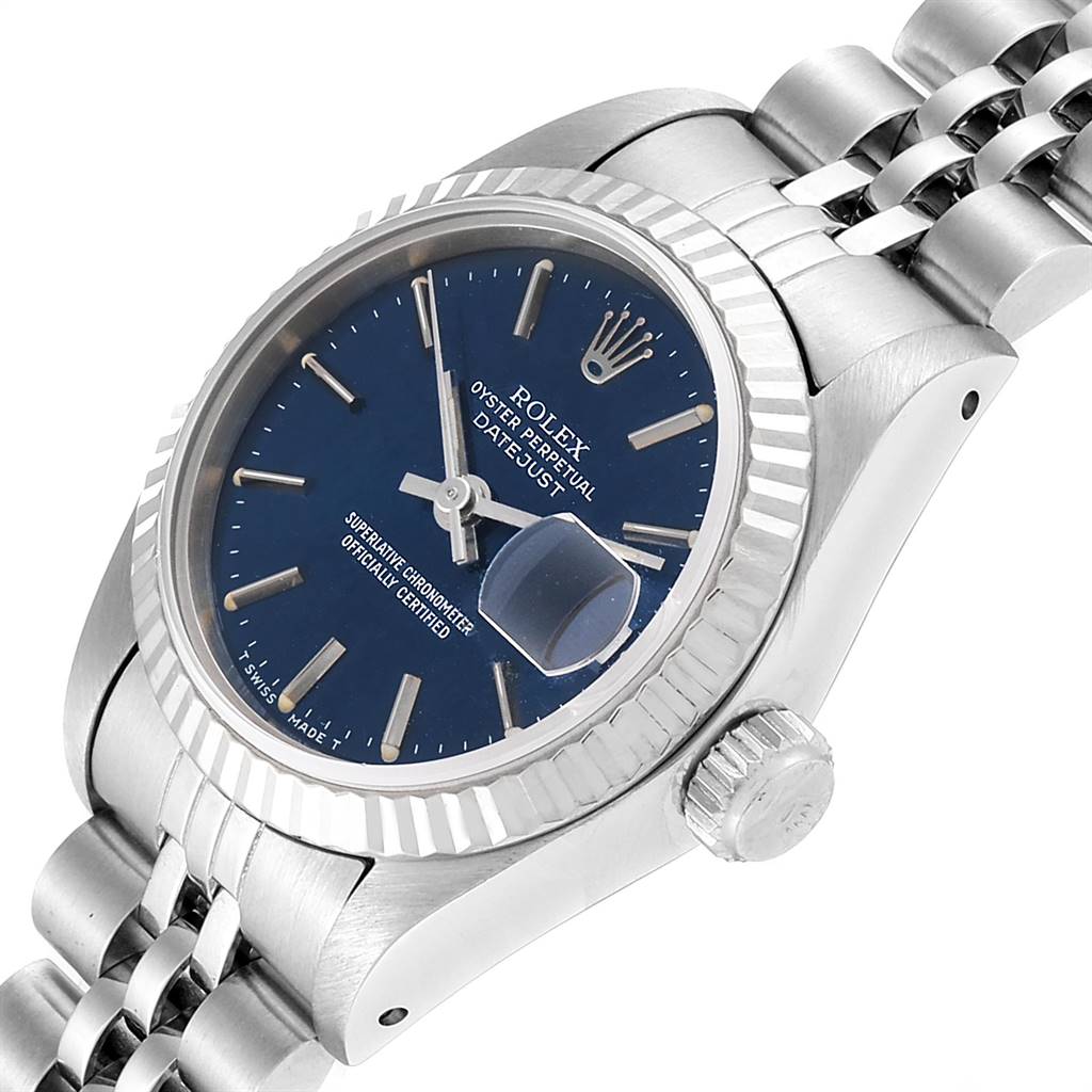 The image shows a side angle of a Rolex Datejust 69174 Women's Stainless Steel Blue Dial 69174 Women's Stainless Steel Blue Dial watch, highlighting the dial, fluted bezel, crown, and a portion of the bracelet.
