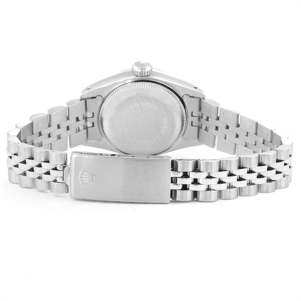 The image shows the back view of a Rolex Datejust 69174 Women's Stainless Steel Blue Dial 69174 Women's Stainless Steel Blue Dial watch, highlighting its case back and metallic bracelet with a clasp.