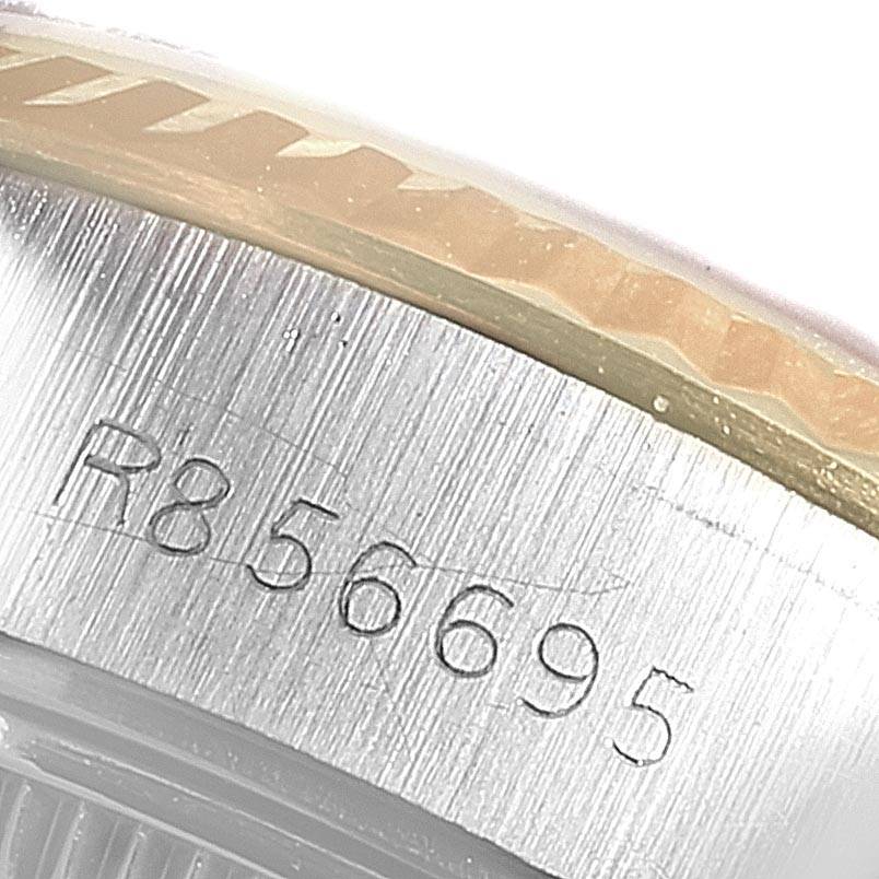 This image shows a close-up of the serial number engraved on the case of a Rolex Datejust 69173 Women's Stainless Steel Beige Dial 69173 Women's Stainless Steel Beige Dial watch.