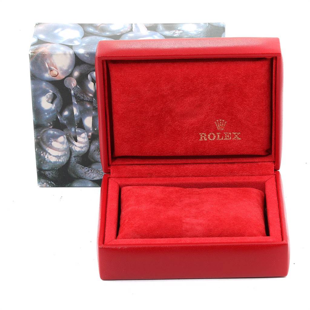 The image shows an open red Rolex watch box with the lid open, revealing a velvet interior for the Datejust model.