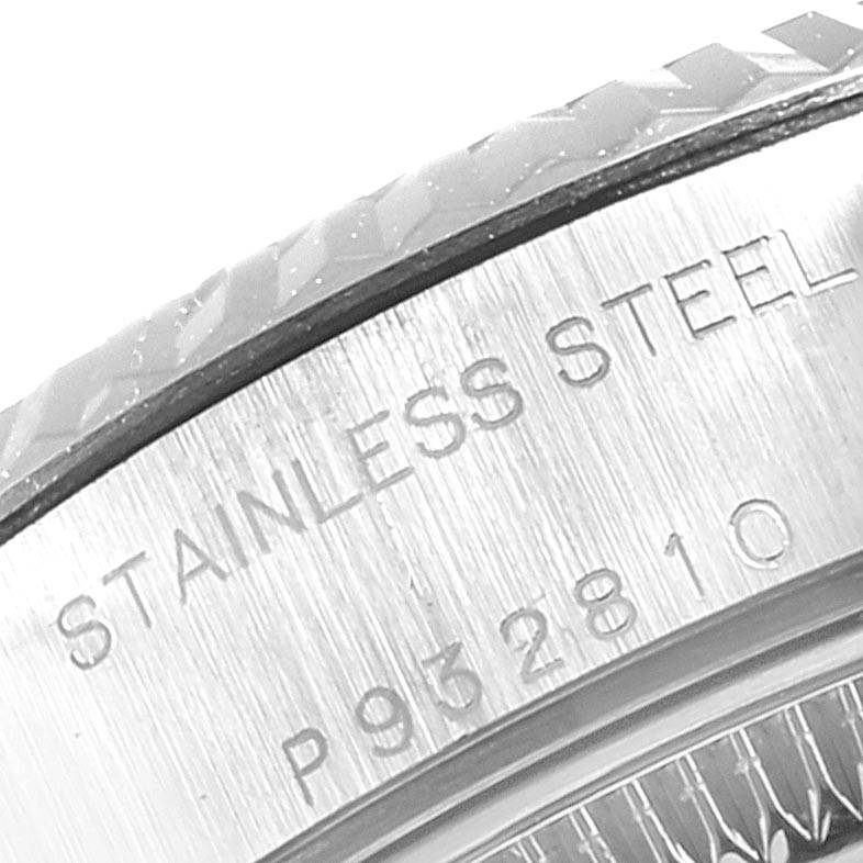 This close-up image shows the stainless steel casing with engraved text of the Rolex Datejust 79174 Women's Stainless Steel Silver Dial 79174 Women's Stainless Steel Silver Dial model.