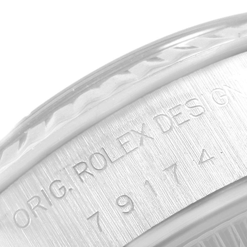 Close-up of the Rolex Datejust 79174 Women's Stainless Steel Silver Dial 79174 Women's Stainless Steel Silver Dial model showing the engraved text on the side of the watch case.