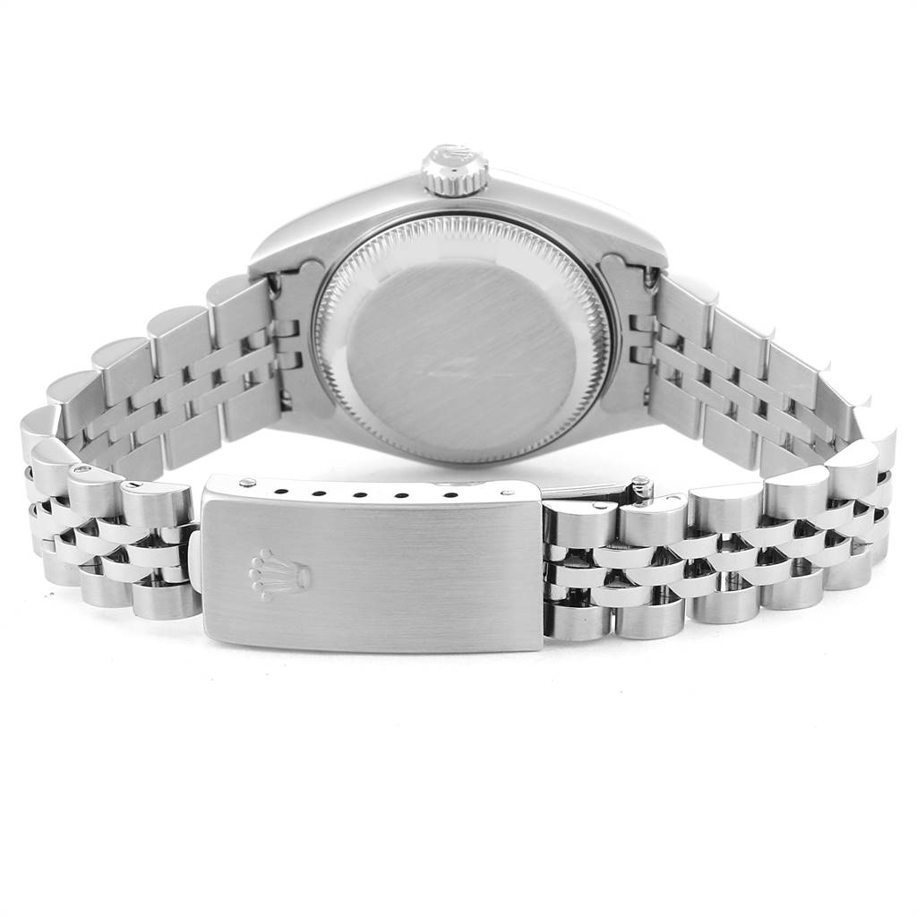 The image shows the backside of a Rolex Datejust 79174 Women's Stainless Steel Blue Dial 79174 Women's Stainless Steel Blue Dial watch, focusing on the case back and the bracelet with the clasp open.