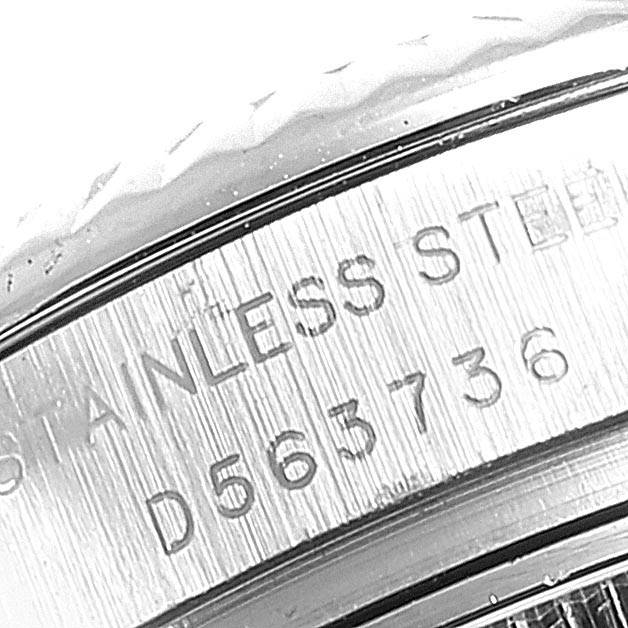 The image shows a close-up of the case side engraving and part of the bezel of a Rolex Datejust 179174 Women's Stainless Steel Grey Dial 179174 Women's Stainless Steel Grey Dial watch.