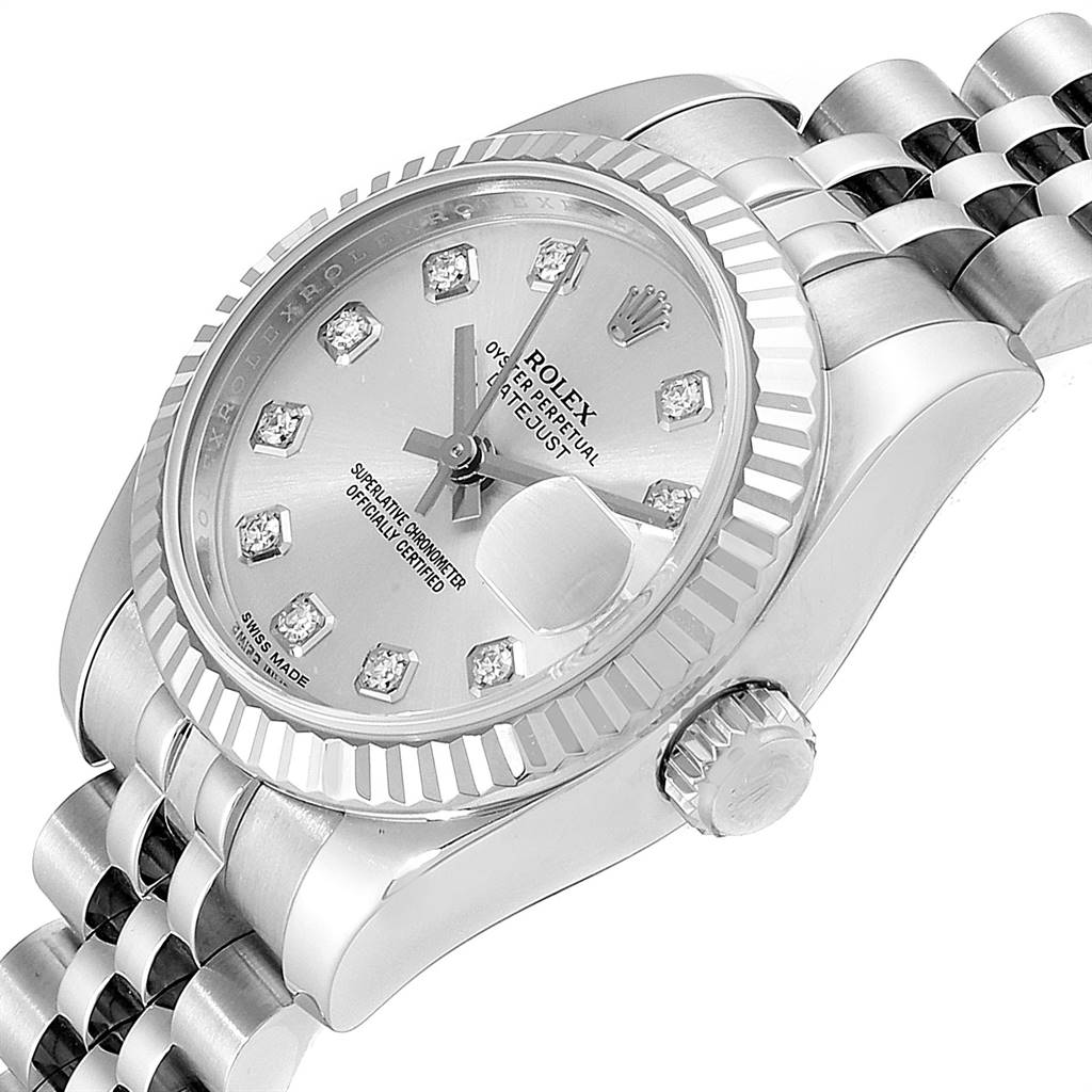 The image shows a close-up of a Rolex Datejust 179174 Women's Stainless Steel Silver Dial 179174 Women's Stainless Steel Silver Dial watch face, crown, and a part of the bracelet at an angled view.