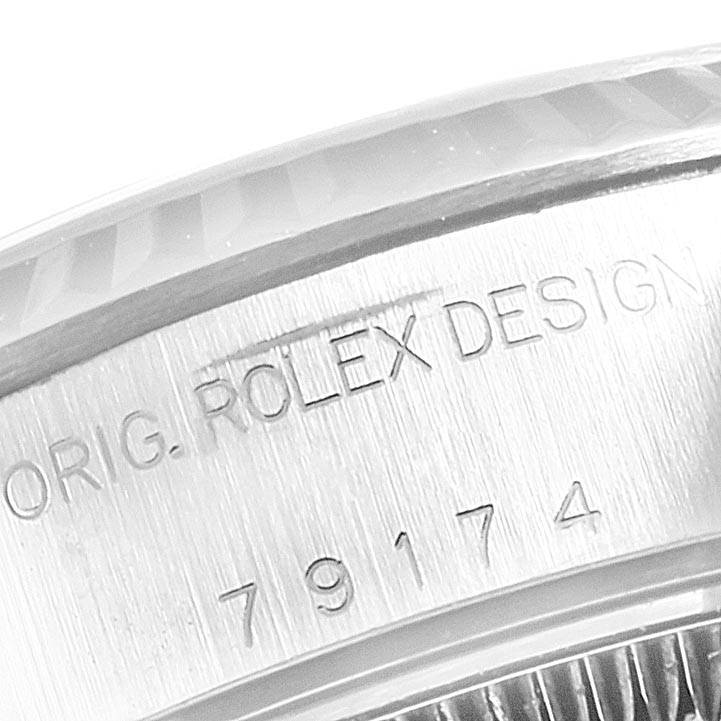 This close-up image shows the model number and engraving on the bezel of a Rolex Datejust 79174 Women's Stainless Steel Silver Dial 79174 Women's Stainless Steel Silver Dial watch.