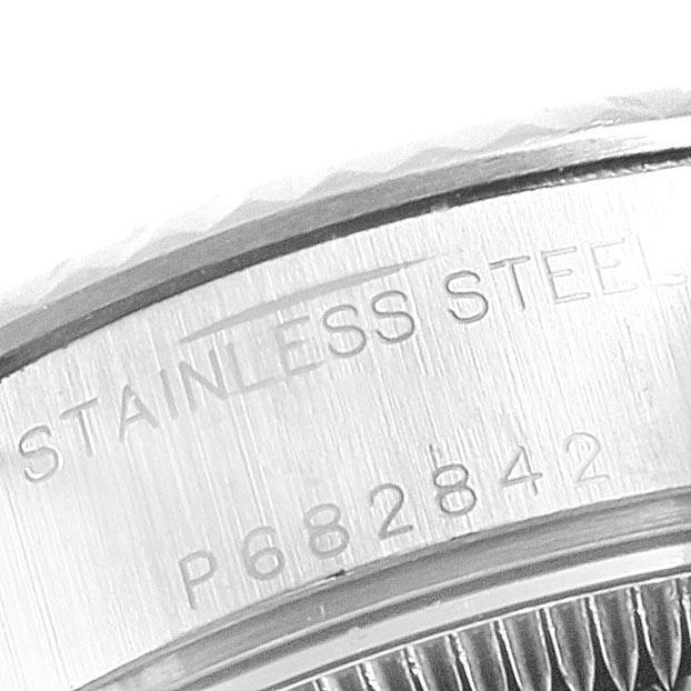 The image shows a close-up view of the stainless steel bezel and the engraved serial number on a Rolex Datejust 79174 Women's Stainless Steel Silver Dial 79174 Women's Stainless Steel Silver Dial watch.