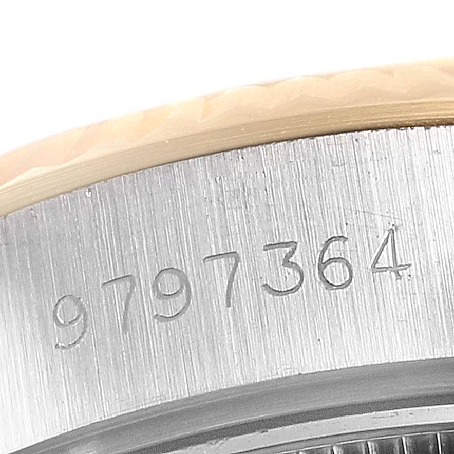 This image shows a close-up angle of the serial number engraved on the casing of a Rolex Datejust 69173 Women's Stainless Steel Champagne Dial 69173 Women's Stainless Steel Champagne Dial watch.