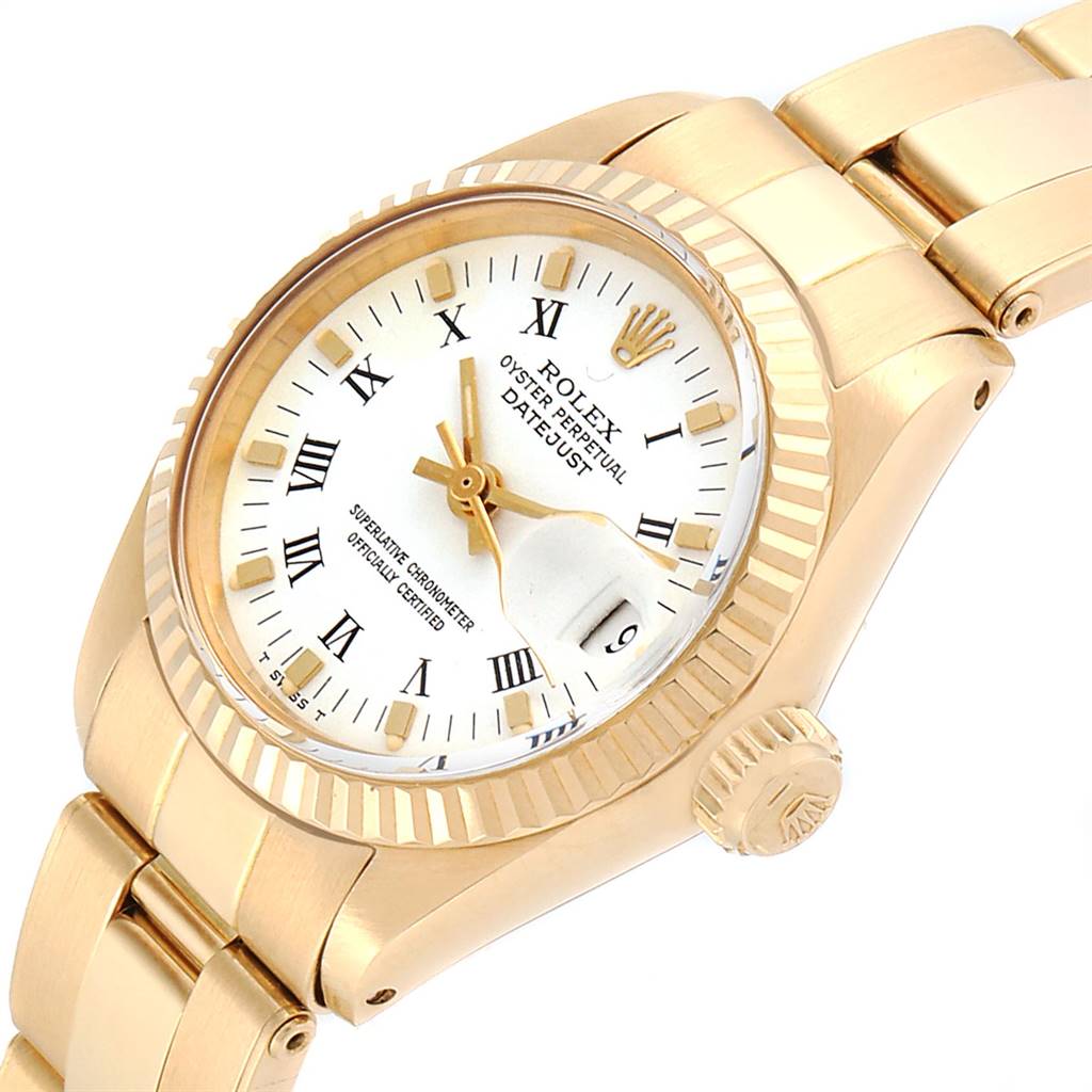 The image shows a Rolex Datejust 6917 Women
s Yellow Gold White Dial 6917 Women
s Yellow Gold White Dial watch angled to display its face, crown, and part of the bracelet.