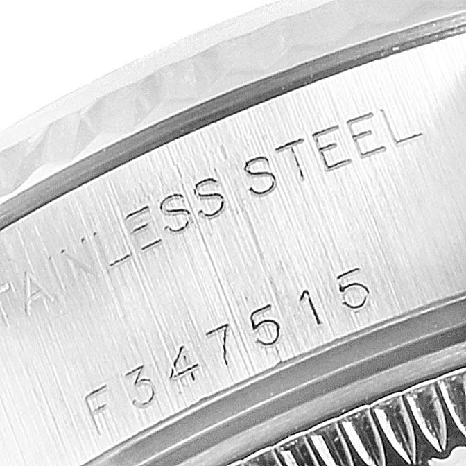 The image shows a close-up of the serial number and "STAINLESS STEEL" text on the Rolex Datejust 79174 Women's Stainless Steel Mother of Pearl Dial 79174 Women's Stainless Steel Mother of Pearl Dial watch casing.