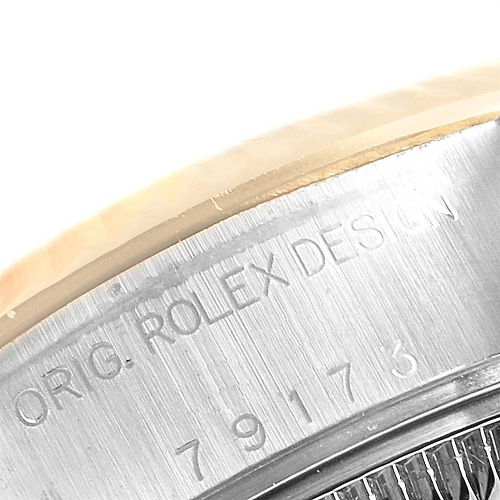 The image shows a close-up of the case back and part of the bezel of a Rolex Datejust 79173 Women's Stainless Steel White Dial 79173 Women's Stainless Steel White Dial watch, highlighting the engraved model number.