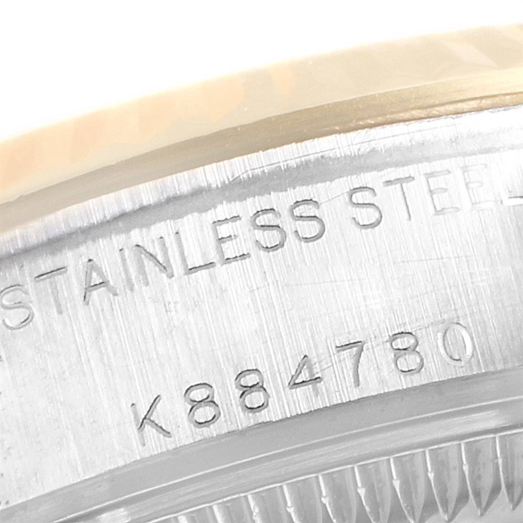 This image shows the engraved serial number on the stainless steel case of a Rolex Datejust 79173 Women's Stainless Steel White Dial 79173 Women's Stainless Steel White Dial watch.