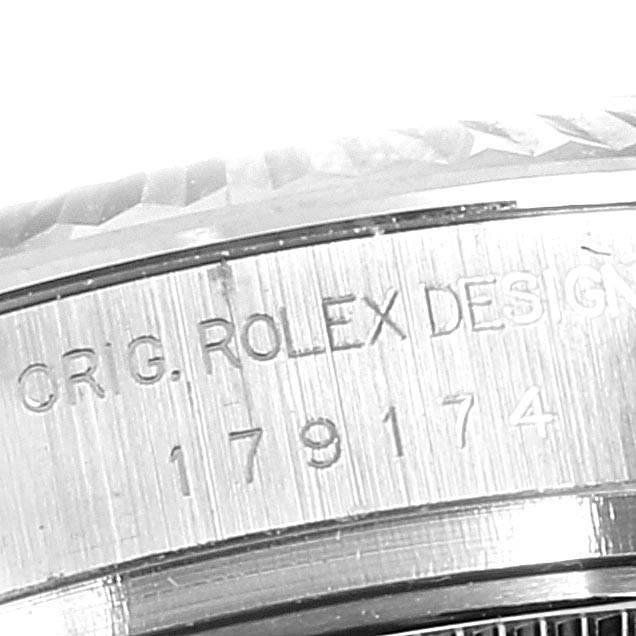 The image shows a close-up of the engraved reference number and text "ORIG. ROLEX DESIGN" on the side of the case of a Rolex Datejust 179174 Women's Stainless Steel Pink Dial 179174 Women's Stainless Steel Pink Dial watch.