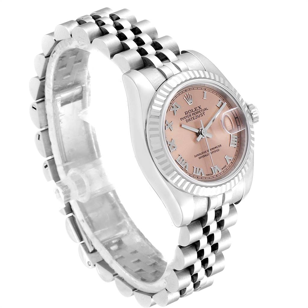 The image shows a Rolex Datejust 179174 Women's Stainless Steel Pink Dial 179174 Women's Stainless Steel Pink Dial watch at a three-quarter angle, featuring a pink dial, fluted bezel, and jubilee bracelet.