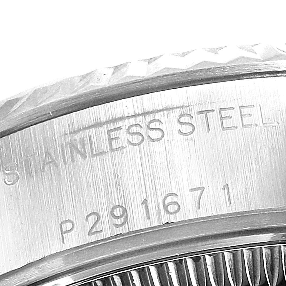 The image shows a close-up of the side of a Rolex Datejust 79174 Women's Stainless Steel Silver Dial 79174 Women's Stainless Steel Silver Dial watch, highlighting the stainless steel case and serial number.