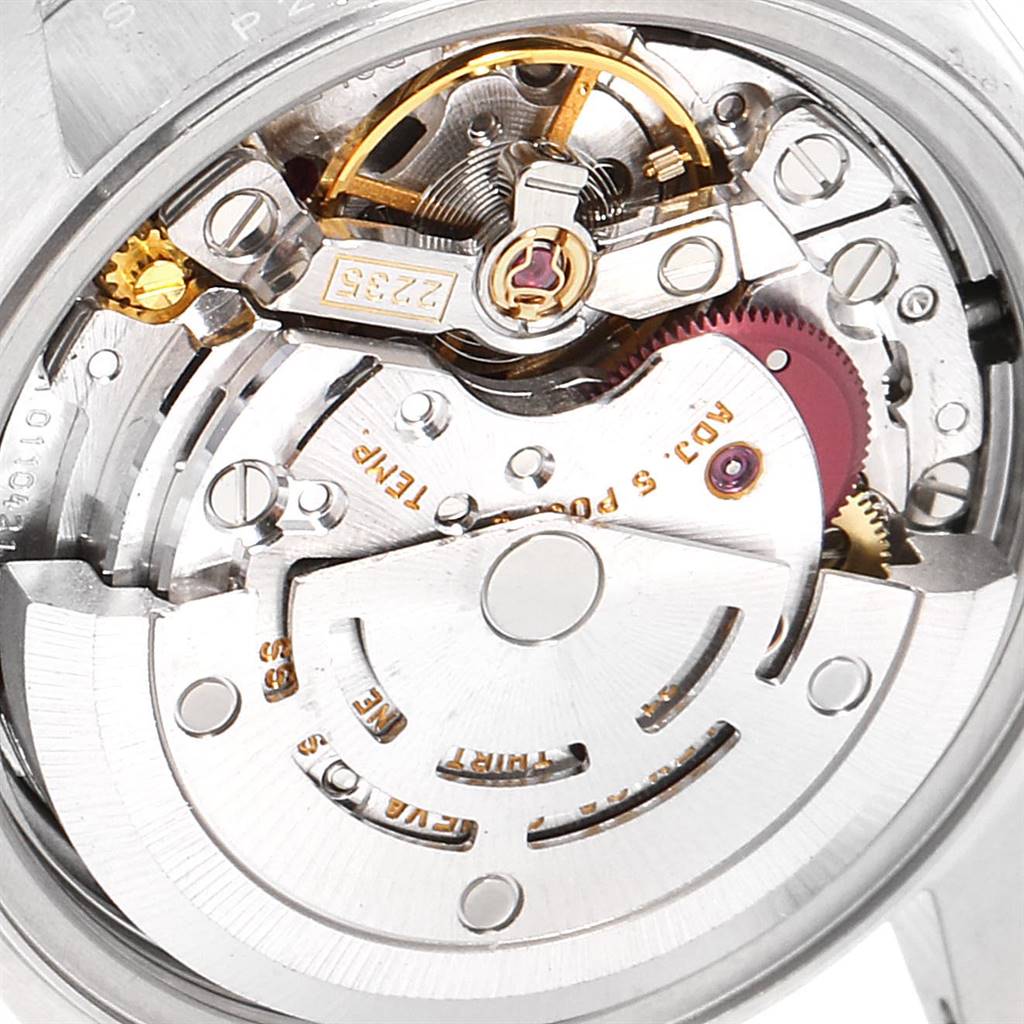 This image shows a close-up of the Datejust model by Rolex, focusing on its intricate internal mechanical movement.