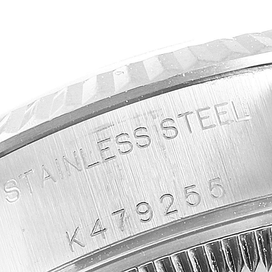The image shows a close-up of the Rolex Datejust 79174 Women's Stainless Steel Grey Dial 79174 Women's Stainless Steel Grey Dial's stainless steel caseback with visible serial and model numbers.