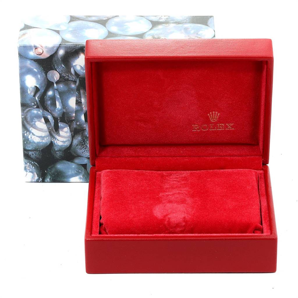 The image shows an empty red Rolex Datejust 69173 Women's Stainless Steel Black Dial 69173 Women's Stainless Steel Black Dial watch box with a pillow insert and a decorative outer box in the background.