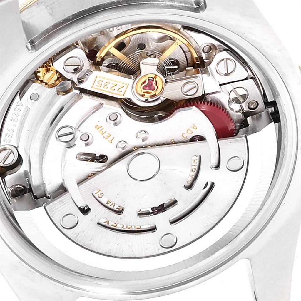 The image shows a close-up of the internal mechanism of a Rolex Datejust 179163 Women's Steel and Gold (two tone) White Dial 179163 Women's Steel and Gold (two tone) White Dial watch, focusing on the movement components.