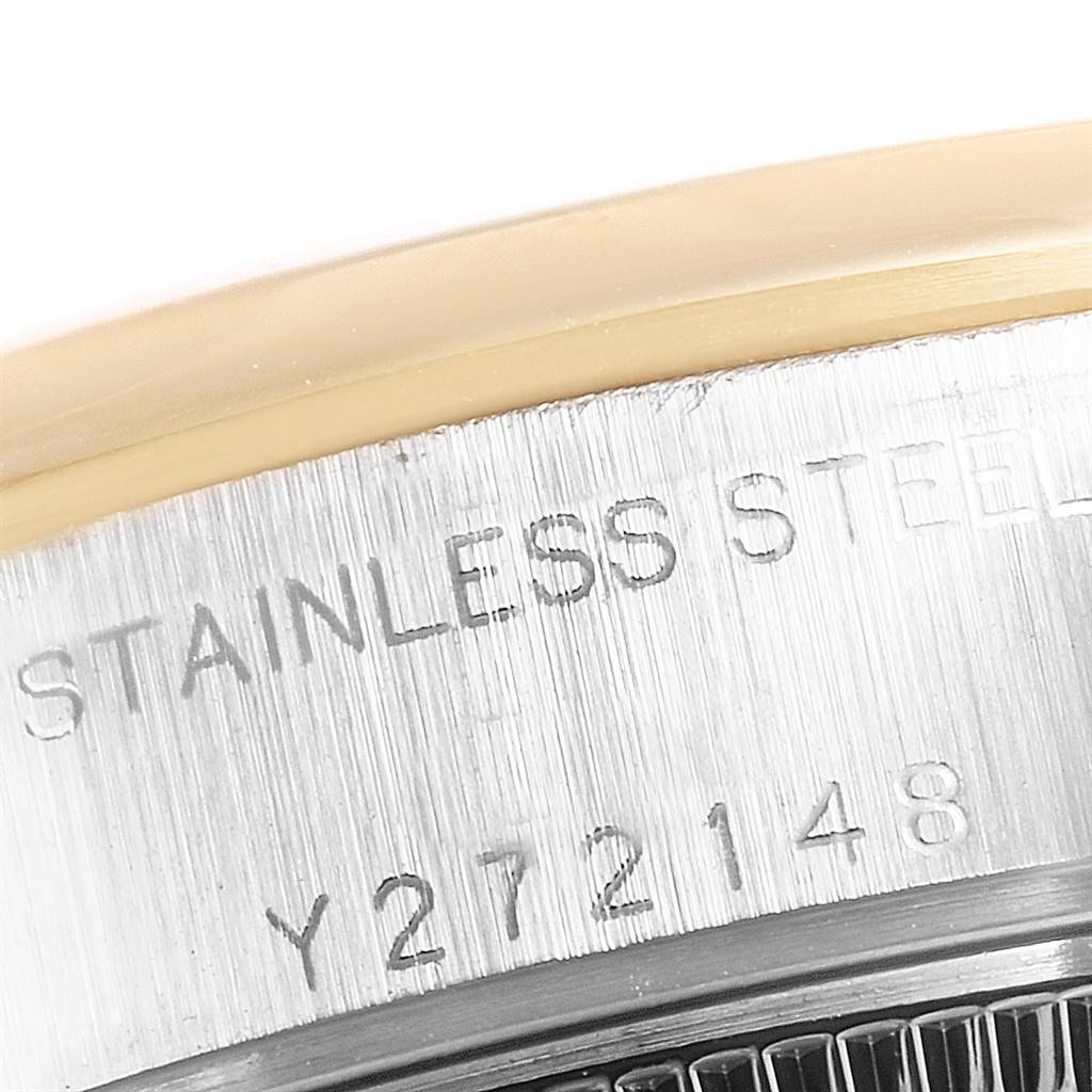 This image shows a close-up of the case back and serial number of a Rolex Datejust 79163 Women's Steel and Gold (two tone) Silver Dial 79163 Women's Steel and Gold (two tone) Silver Dial watch, highlighting the "STAINLESS STEEL" engraving.