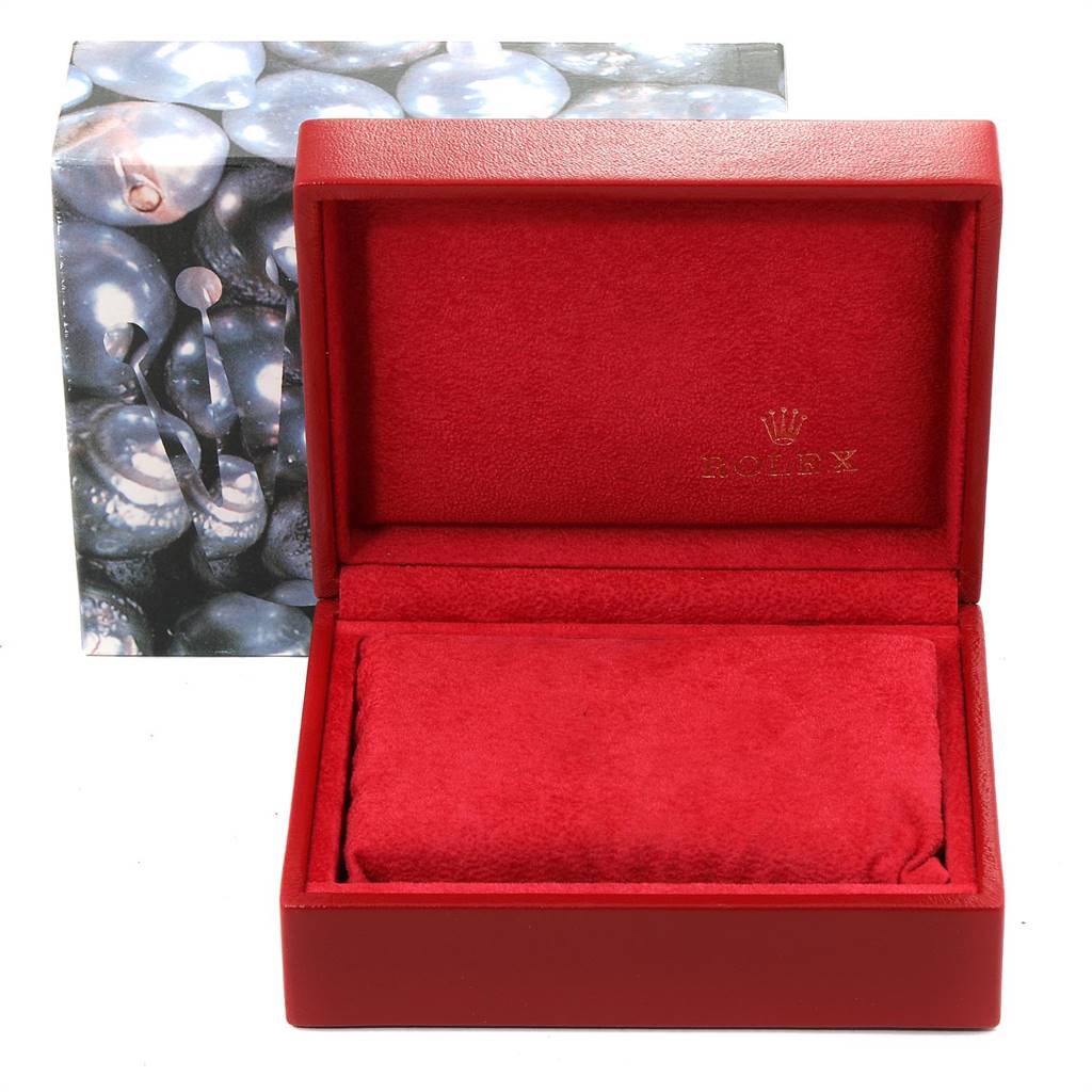 This image shows the open red presentation box for a Rolex Datejust 79163 Women's Steel and Gold (two tone) Silver Dial 79163 Women's Steel and Gold (two tone) Silver Dial watch, with the brand logo inside the lid.