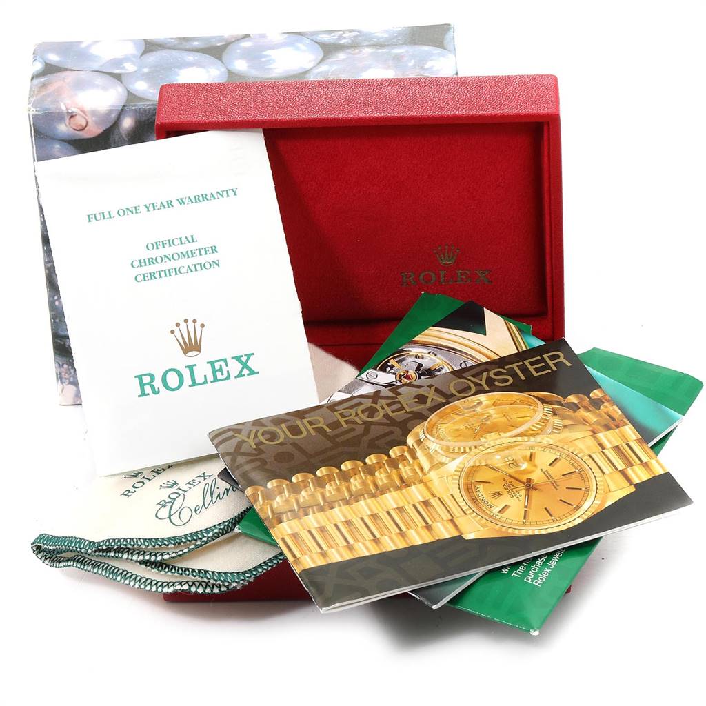 The image shows the packaging and documentation for the Rolex Datejust 79173 Women's Steel and Gold (two tone) White Dial 79173 Women's Steel and Gold (two tone) White Dial model, including a warranty certificate and brochures.