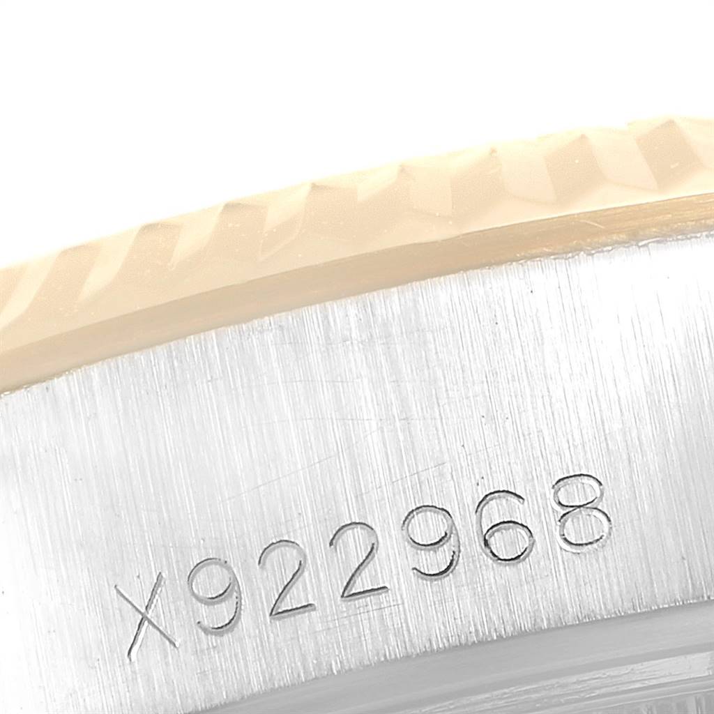 This close-up image shows the side view of a Rolex Datejust 69173 Women's Stainless Steel Black Dial 69173 Women's Stainless Steel Black Dial watch case with visible serial number engraving.